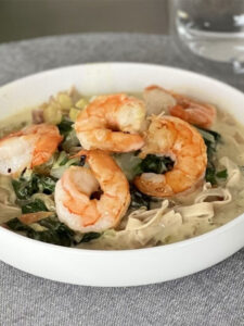 Tagliatelle with Thai yellow curry and tiger prawns